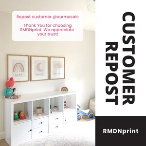 May include: A white storage unit with three framed prints of a rainbow, moon, and clouds. The prints are above the unit, which holds toys and a doll. The text "Repost customer @ourmosaic" is visible.