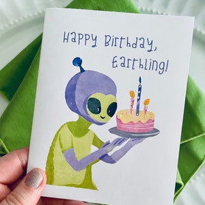 Cute alien with a birthday cake card “Happy Birthday, Eathling!” sci-fi birthday card, ufo birthday card, nerd birthday card, alien gift