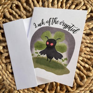 Tarjeta de felicitación del día de San Patricio de Mothman Luck of the Cryptid, tarjeta de terror del día de San Patricio