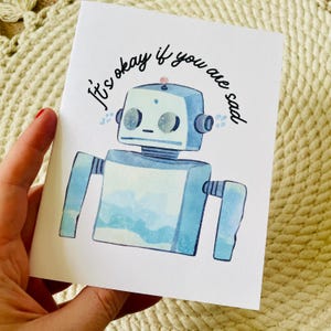 Tarjeta de condolencias con el mensaje “Está bien si estás triste” de robot retro, tarjeta de duelo con robot, tarjeta de aliento con robot, tarjeta de pérdida de trabajo, tarjeta de aliento con robot