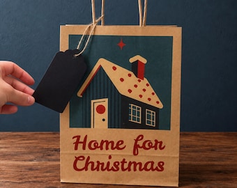 Bolsa de regalo navideña conmemorativa "Home For Christmas" en papel kraft natural con etiqueta de regalo.