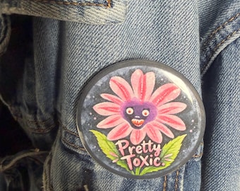 Botón con broche de flor tóxica