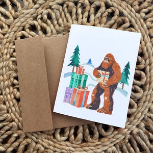 Biglietto di Natale colorato con il cartone animato Bigfoot