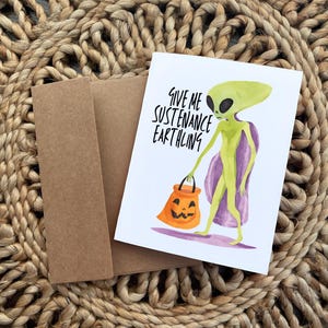 Carte d'Halloween Donne-moi de la nourriture Terrien - Des trucs ou des friandises extraterrestres amusants