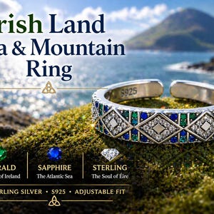 May include: A silver ring with a geometric pattern of green, blue, and clear stones, set against a coastal backdrop. The ring is inscribed with "S925" and the text "Irish Land Sea & Mountain Ring".