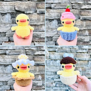 May include: Four crocheted amigurumi ducklings in different cupcake designs. Each duckling is wearing a crocheted cupcake hat and sitting in a crocheted cupcake base. The cupcakes are in different colors and designs, including pink, blue, and brown.