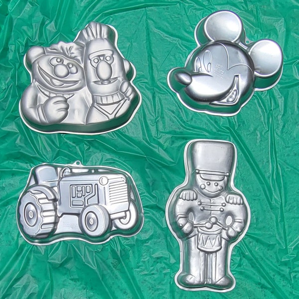 Vintage Wilton Cake Pans: Ernie and Bert, Mickey Mouse, a Tractor, a Nutcracker, and Dottie the Cheerleader Dog, decorative Cake Tins