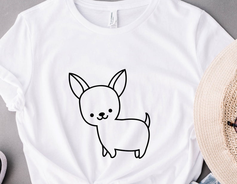 May include: White t-shirt with a black line drawing of a chihuahua on the front.