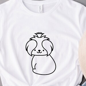 May include: White t-shirt with a black line drawing of a Shih Tzu dog.