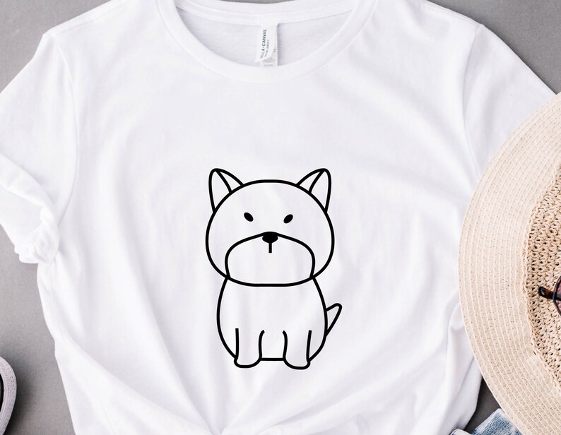 May include: White t-shirt with a black line drawing of a dog on the front.
