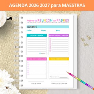 May include: A spiral-bound planner page titled AGENDA 2026 2027 para MAESTRAS featuring a Registro de REUNIÓN con PADRES form. The white sheet includes sections for student name, date, course, time, meeting motives, positive aspects, areas for improvement, and action plans.