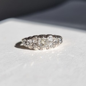 Fabulous Georgian or early Victorian style engagement ring with Old mine cut diamonds, silver and gold. 9-stone silver collet diamond ring