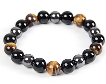 May include: A beaded bracelet with black, brown, and silver beads. The bracelet is made of natural stones.
