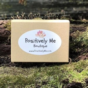 May include: A brown cardboard box with a white oval sticker that says "Positively Me Boutique" and "www.PositivelyMe.com".
