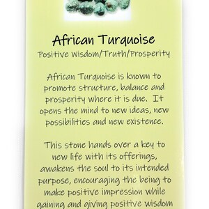 May include: A close-up of a pile of green and blue African turquoise stones. The stones are on a yellow background with the text "African Turquoise" and "Positive wisdom/Truth/Prosperity". The text below describes the stone's properties and benefits. The website address "www.PositivelyMe.com" is at the bottom.