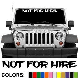 May include: A white Jeep Wrangler with a black grille and a windshield banner that reads "NOT FOR HIRE". The banner is available in a variety of colors.
