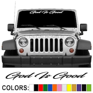 May include: A white Jeep Wrangler with a black grille and a windshield decal that reads "God Is Good". The decal is available in a variety of colors, including black, red, green, blue, orange, pink, white, yellow, gold, purple, and silver.