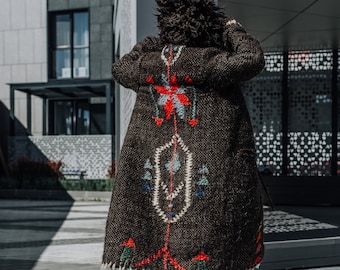 Brown long wool coat with hood and unique geometric pattern on the back