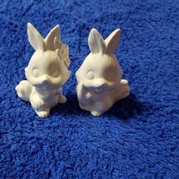 Two ceramic unpainted bunnies