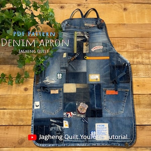 May include: A denim apron made from patchwork denim fabric. The apron has a large pocket on the front and a smaller pocket on the side. The apron is decorated with various denim patches, including a patch that says "Commando". The apron is hanging on a wooden wall.
