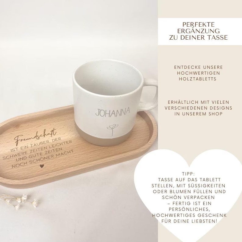 May include: A white ceramic mug with the name "Johanna" and a small floral design, resting on a wooden serving tray. The tray has the word "Freundschaft" and other text. The mug and tray set is a perfect gift.