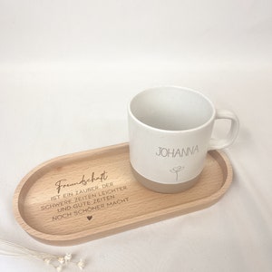May include: A wooden tray with the text "Friendship is a magic that makes hard times easier and good times even better" engraved on it. A white mug with the name "Johanna" is on the tray.