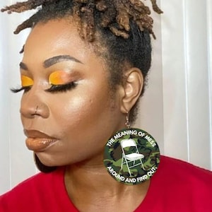 The meaning of mess around and find out earrings, Alabama brawl, folding chair earrings, Montgomery brawl, black history, camouflage earring