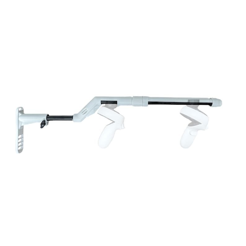 May include: White wall mount for VR controllers with a long, adjustable arm. The arm is made of black metal and has a white plastic base. The mount can hold two VR controllers.