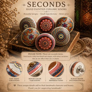 May include: Six hand-painted ceramic knobs with intricate, colorful designs. The knobs feature red, blue, and orange patterns. The image includes text that reads "SECONDS" and "HAND PAINTED CERAMIC KNOBS". The knobs are displayed on a book.