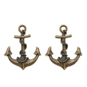 May include: Two bronze-colored anchor charms. Each anchor has a looped top, a crossbar, and a central rope detail. The anchor's flukes are curved. The charms are set against a white background.