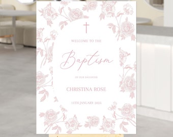 Pode incluir: Um cartaz branco com uma borda floral rosa e uma cruz no topo. O texto diz "Bem-vindo ao Batismo de nossa filha Christina Rose 15 de janeiro de 2025".