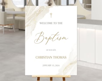 May include: White welcome sign with gold accents and a cross at the top. The sign reads "Welcome to the Baptism of our son Christian Thomas January 15, 2024".