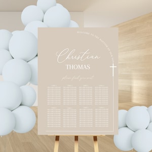 May include: A beige seating chart for a baptism with the text "Welcome to the Baptism of our son Christian Thomas, please find your seat." The chart lists tables and names of guests.