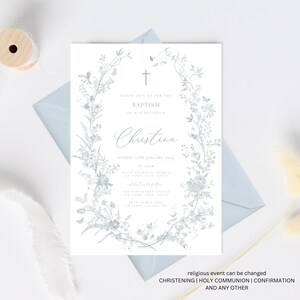 May include: A blue and white floral wreath with a cross at the top surrounds the text "Please join us for the Baptism of our daughter Christina Sunday 15th January 2023 at 10am Saint Catherine Church 123 Town, City, State Reception to follow The Pepperdine Terrace 123 Town, City, State RSVP by May 2023 to Jenny 123-456-7890".