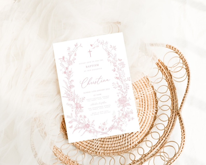 May include: A white card with pink floral illustrations and a cross. The text on the card reads "Please join us to celebrate the Baptism of our daughter Christina" followed by the date, time, and location of the event.
