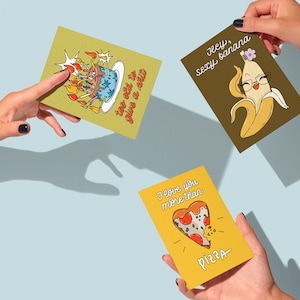 Hands are holding A6 mini greeting cards mockup