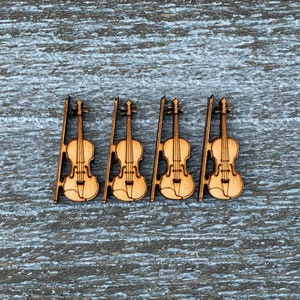 May include: Four wooden cutout violins with a natural wood finish. The violins are arranged in a row on a woodgrain background.