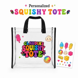 May include: A clear plastic tote bag with black handles and trim, featuring the colorful text "CLAUDIA'S SQUISHY TOTE" and cartoon graphics. A separate sheet of colorful stickers including ice cream, dumplings, and shapes is displayed next to it.