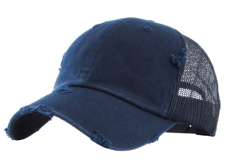 May include: A navy blue baseball cap with a distressed appearance. The front panels and peak are solid, while the back has a black mesh for ventilation. The cap has a curved peak and a classic six-panel design.