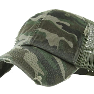 May include: Camouflage baseball cap with a distressed appearance. The cap has a curved peak and a mesh back for ventilation. The camouflage pattern features green, brown, and tan shades.