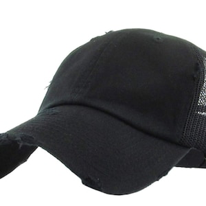 May include: Black baseball cap with a distressed peak and mesh back panel. The cap features a curved visor and a classic six-panel design. The fabric appears to be a soft cotton blend. The cap is a solid black colour.