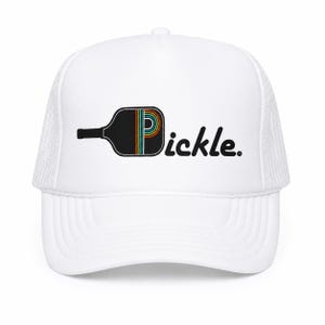 May include: A white trucker hat featuring a graphic of a black pickleball paddle where the letter P is replaced by the paddle shape. The paddle contains thin, colorful, horizontal stripes in orange, yellow, teal, and white. The text reads Pickle.