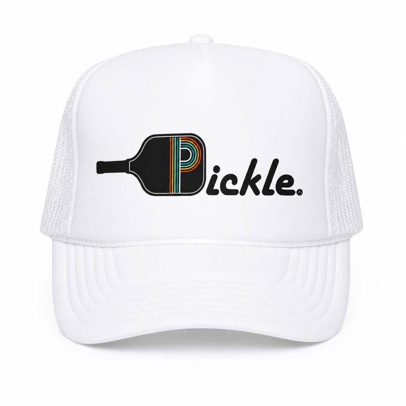 May include: A white trucker hat featuring a graphic of a black pickleball paddle where the letter P is replaced by the paddle shape. The paddle contains thin, colorful, horizontal stripes in orange, yellow, teal, and white. The text reads Pickle.