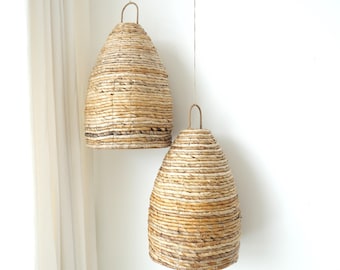 Hanging lampshade in the shape of a beehive , made from dried banana leaves in Bali, Indonesia, boho, tropical, gift