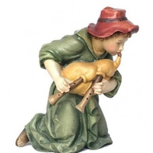Shepherd playing the bagpipe
