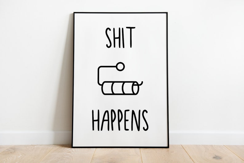 May include: Black and white print with the text "SHIT HAPPENS" and a simple line drawing of a toilet paper roll.