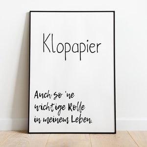 Puede incluir: Un p&oacute;ster enmarcado en negro con texto blanco que dice "Klopapier Auch so 'ne wichtige Rolle in meinem Leben." El texto est&aacute; escrito en estilo manuscrito.