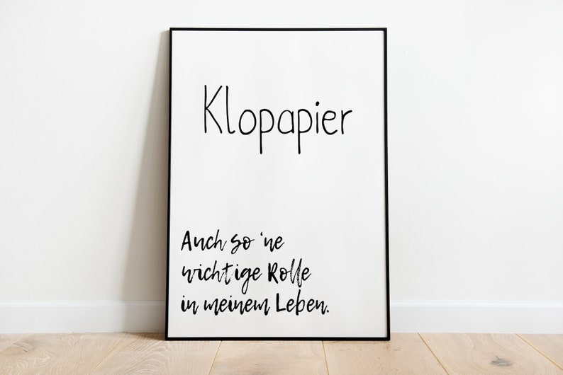 Puede incluir: Un p&oacute;ster enmarcado en negro con texto blanco que dice "Klopapier Auch so 'ne wichtige Rolle in meinem Leben." El texto est&aacute; escrito en estilo manuscrito.