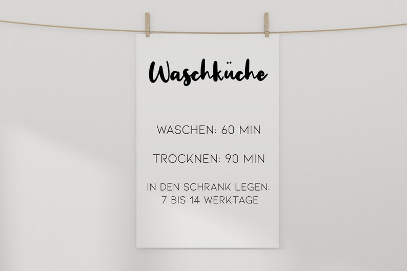 May include: A white sign with black text that reads "Waschk&uuml;che" (German for laundry room). The sign also includes instructions for washing and drying laundry, as well as how long it takes to put laundry away: "Waschen: 60 Min" (Wash: 60 minutes), "Trocknen: 90 Min" (Dry: 90 minutes), "In den Schrank legen: 7 bis 14 Werktage" (Put in the closet: 7 to 14 working days).