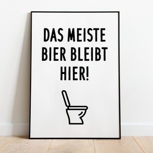 May include: A black and white poster with the text "Das Meiste Bier Bleibt Hier!" and a black outline of a toilet.